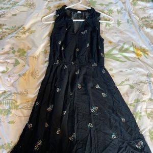 Black work dress with daisys on it